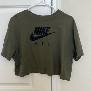 This is a green crop top from Nike.